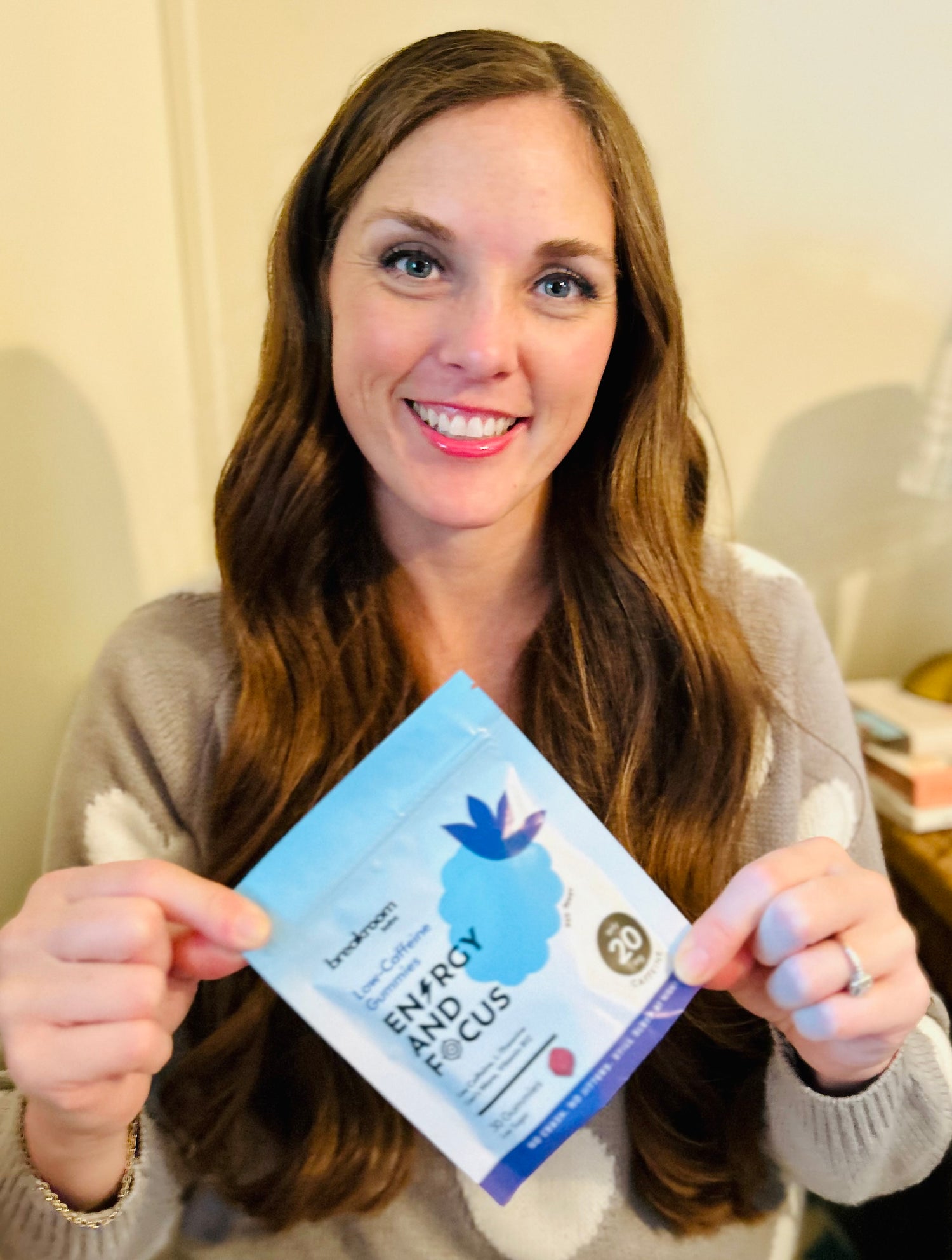 Hanna holding a package of Breakroom Labs Gummie
